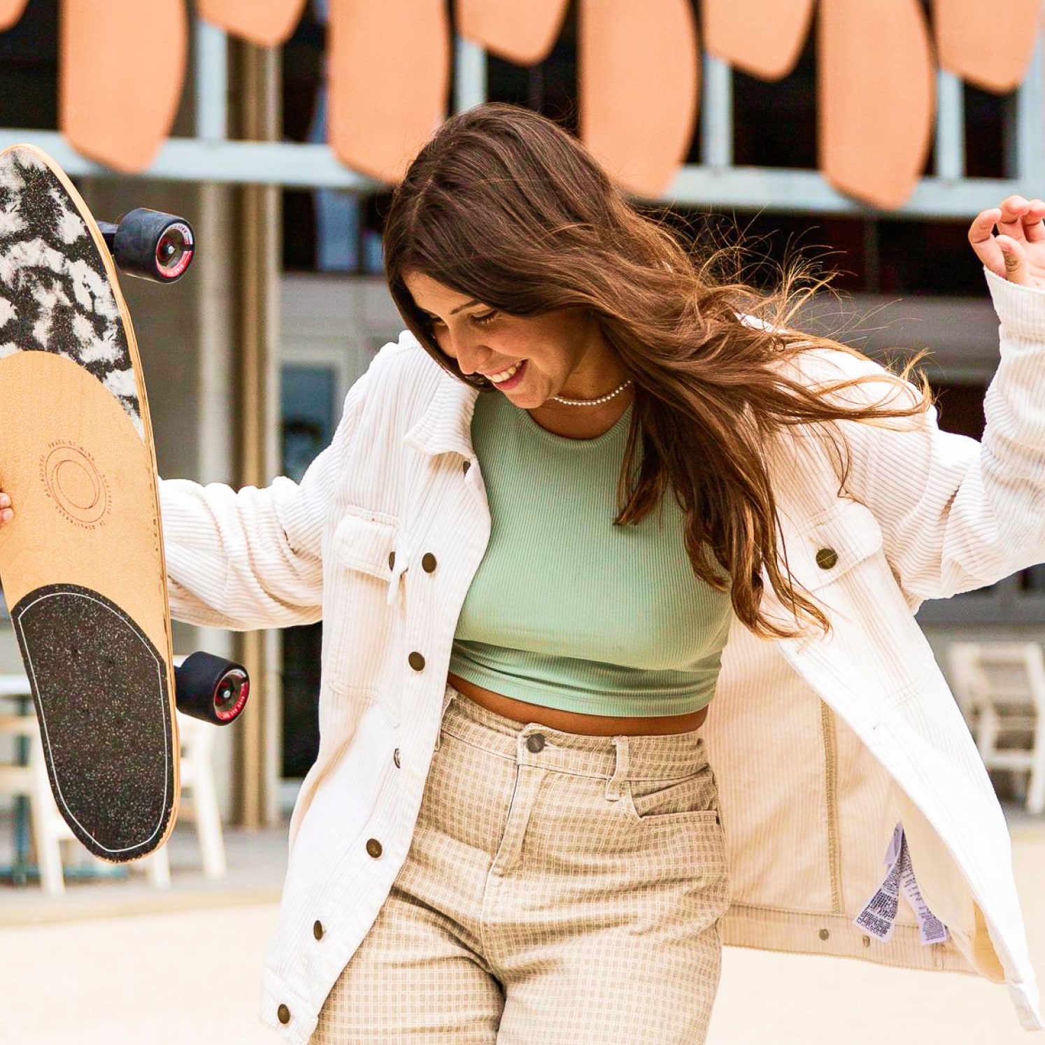Student holding skateboard